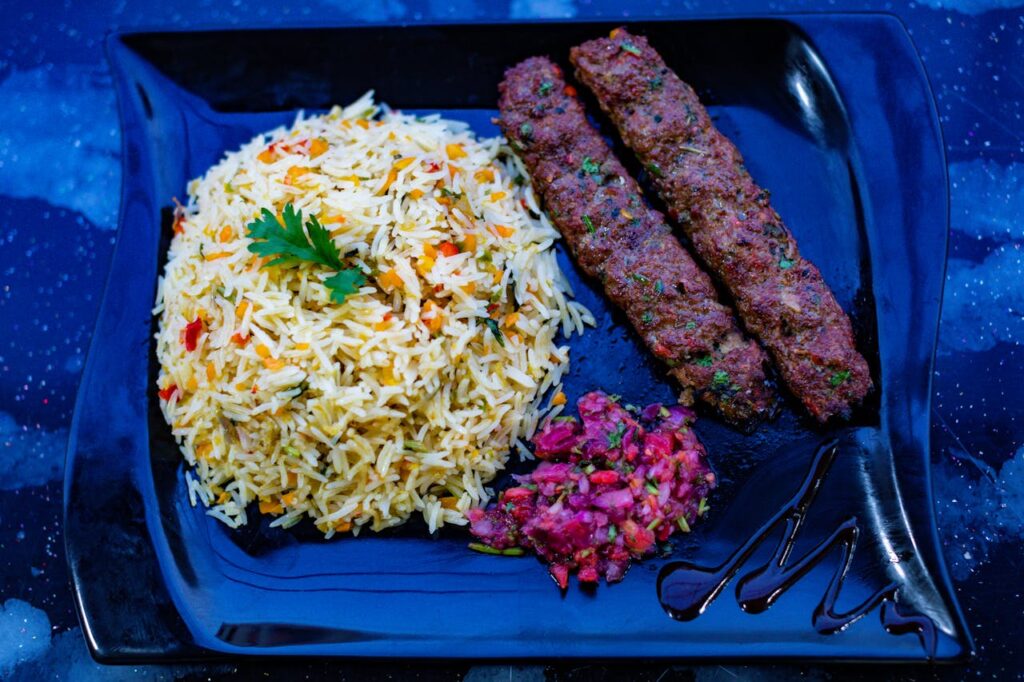 Fried Rice and Kebab on Blue Plate